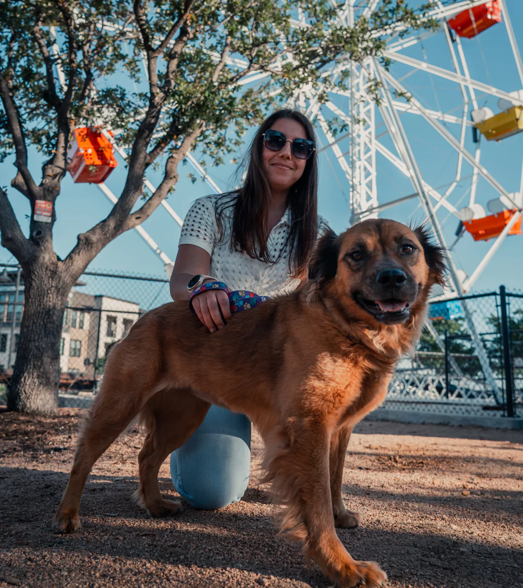 Woman and Dog in front of Ferris Wheel